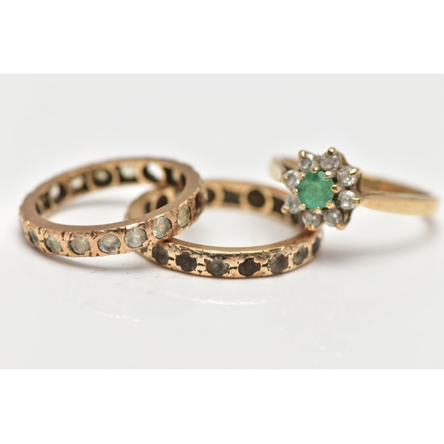 21 - THREE GEM SET RINGS, the first a 9ct gold cluster ring set with a circular cut emerald within a surr... 