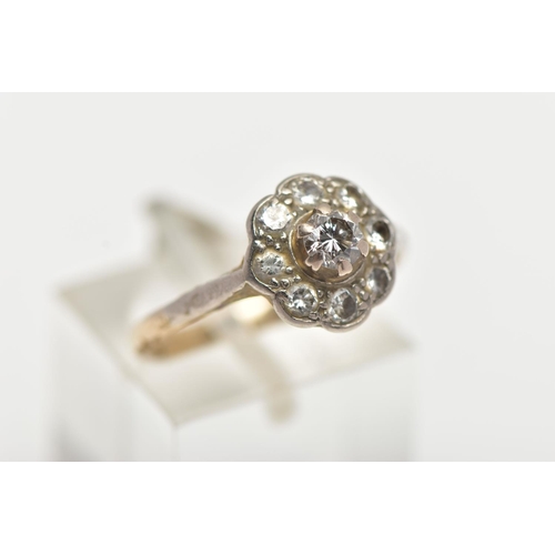 25 - A WHITE METAL DIAMOND CLUSTER RING, of a flower shape, set with nine round brilliant cut diamonds, e... 