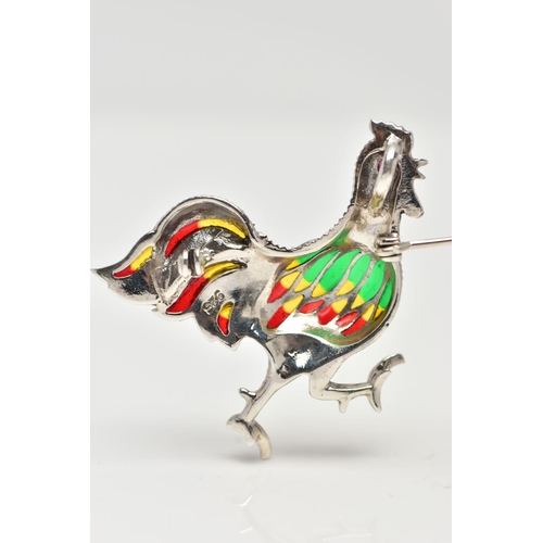 27 - A WHITE METAL PLIQUE A JOUR BROOCH, in the form of a cockerel, marcasite detail to the body with a r... 