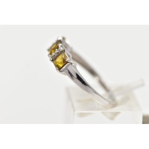 30 - A WHITE GOLD GEM SET RING, set with three square cut yellowish/green stones, interspaced with single... 