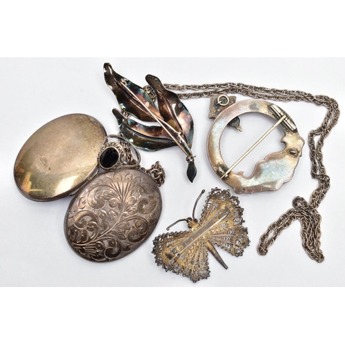 36 - AN ASSORTMENT OF SILVER AND WHITE METAL JEWELLERY, to include a large silver locket, oval form, engr... 