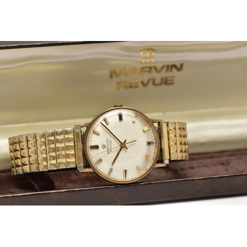 44 - A 9CT GOLD 'MARVIN' WRISTWATCH, manual wind, round dial, signed 'Marvin Revue', baton markers, polis... 