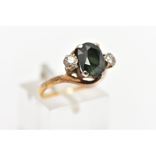 47 - A YELLOW METAL SAPPHIRE AND DIAMOND RING, centering on an oval cut bluish/green sapphire in a four c... 