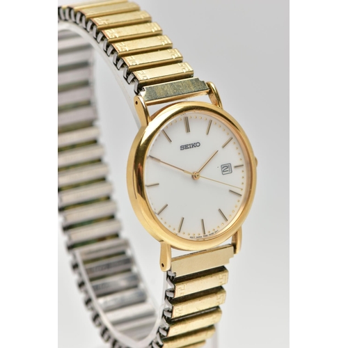 52 - A 9CT GOLD 'SEIKO' WRISTWATCH, a quartz movement, round white dial, signed 'Seiko', baton markers, d... 