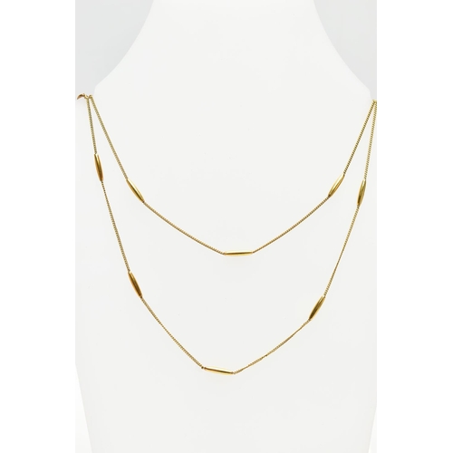 6 - A YELLOW METAL NECKLACE, designed as a series of plain polished tubular links, to the flat curb link... 