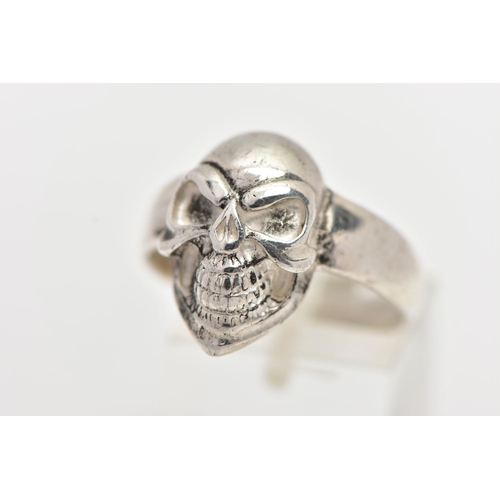 69 - A WHITE METAL SKULL RING, polished skull to the band, stamped 925, ring size U, approximate gross we... 