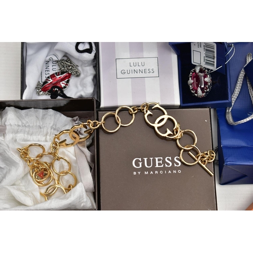 80 - AN ASSORTMENT OF BRANDED COSTUME JEWELLERY AND WATCHES, to include a 'Guess' yellow metal fancy link... 