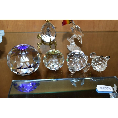 308 - FOUR SWAROVSKI CRYSTAL ORNAMENTS AND TWO COLOURED CRYSTAL PAPERWEIGHTS, comprising a Santa Maria -16... 