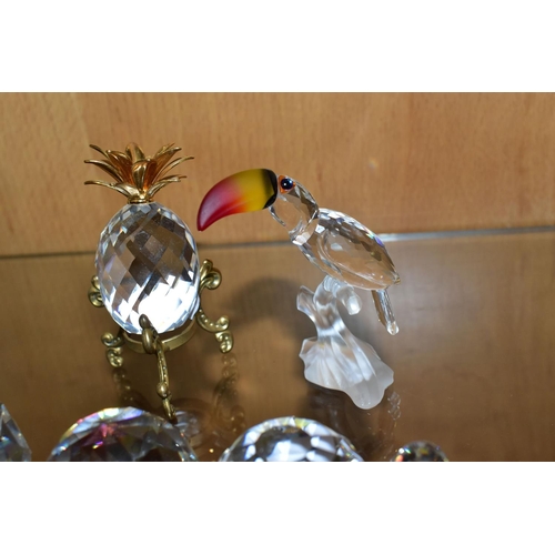 308 - FOUR SWAROVSKI CRYSTAL ORNAMENTS AND TWO COLOURED CRYSTAL PAPERWEIGHTS, comprising a Santa Maria -16... 