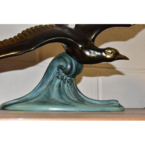 351 - A FRENCH ART DECO SCULPTURE AND PHOTOGRAPH FRAME, the sculpture of a seagull in flight modelled bein... 