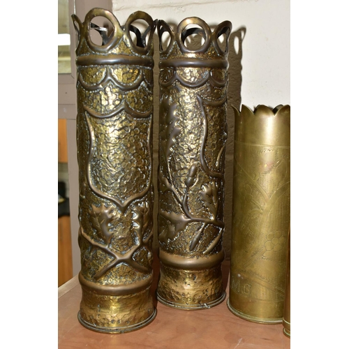 368 - A GROUP OF TRENCH ART, comprising two small shells, height 14cm and 18cm, a matching pair of shell c... 