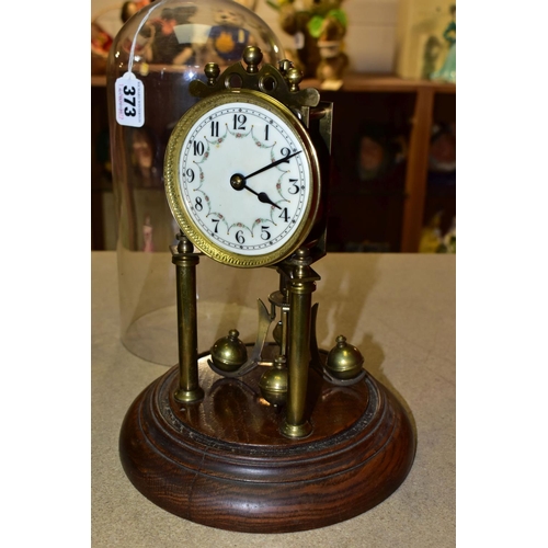 373 - A GLASS DOMED ANNIVERSARY CLOCK, columns, crown and pendulum with brass application , wooden pedesta... 