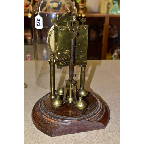 373 - A GLASS DOMED ANNIVERSARY CLOCK, columns, crown and pendulum with brass application , wooden pedesta... 