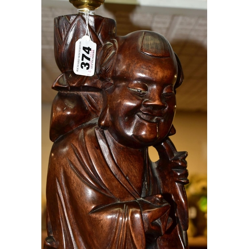 374 - A LARGE WOODEN FIGURAL TABLE LAMP, a hand carved figure of Chinese Shou Lao (god of Longevity), lotu... 