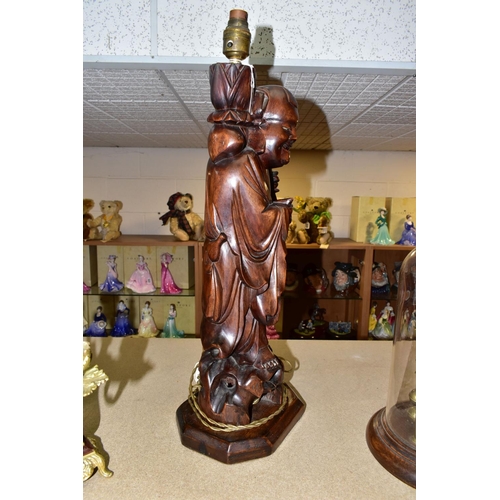 374 - A LARGE WOODEN FIGURAL TABLE LAMP, a hand carved figure of Chinese Shou Lao (god of Longevity), lotu... 