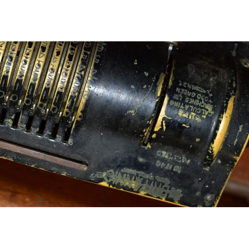 394 - A GUYS BRITANNIC CALCULATING MACHINE, with wooden cover