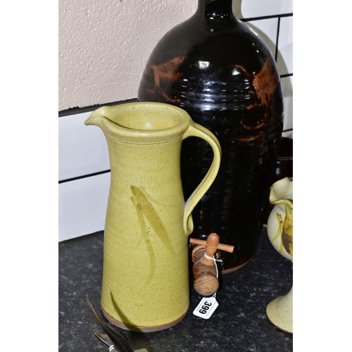 399 - A GROUP OF STUDIO POTTERY, to include a brown glazed cider flagon, height 44cm, with four matching g... 