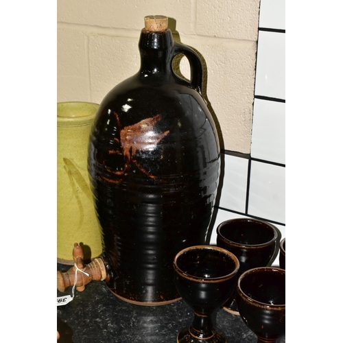 399 - A GROUP OF STUDIO POTTERY, to include a brown glazed cider flagon, height 44cm, with four matching g... 