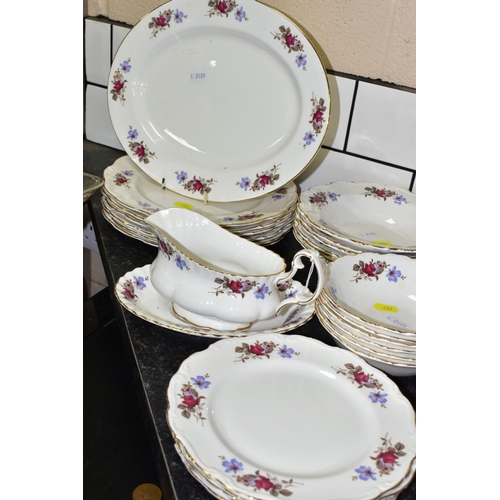 401 - A TWENTY NINE PIECE SAINT JAMES CHINA DINNER SERVICE, comprising a sauceboat and stand, a meat plate... 