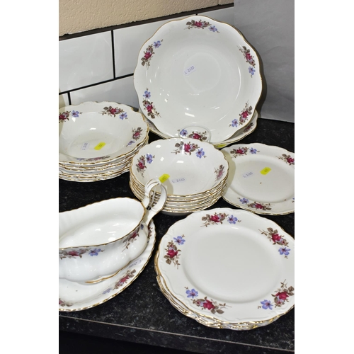 401 - A TWENTY NINE PIECE SAINT JAMES CHINA DINNER SERVICE, comprising a sauceboat and stand, a meat plate... 