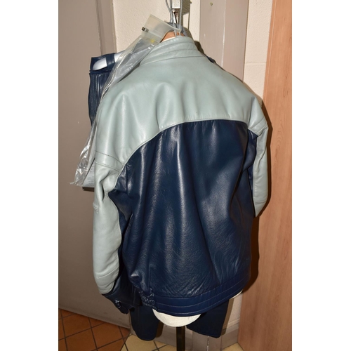 407 - A MOTORCYCLE LEATHER JACKET, TROUSERS, GLOVES AND BOOTS,  comprising a BMW navy and grey leather jac... 