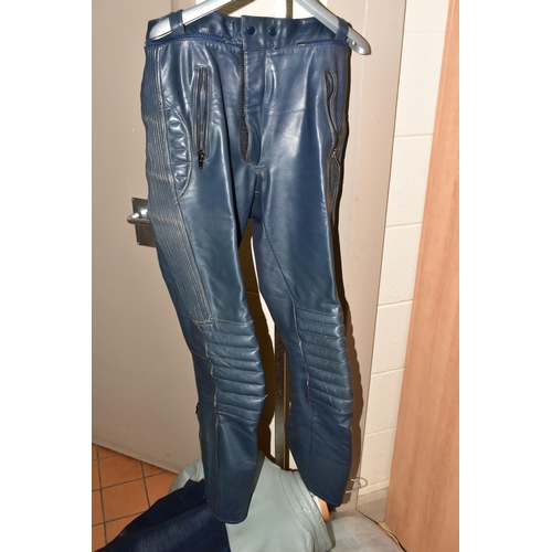 407 - A MOTORCYCLE LEATHER JACKET, TROUSERS, GLOVES AND BOOTS,  comprising a BMW navy and grey leather jac... 