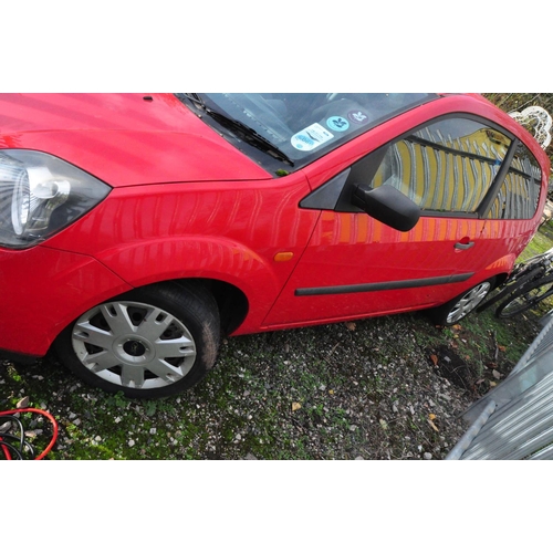 1001 - A 2006 FORD FIESTA 3 DOOR HATCHBACK CAR in red, 1242cc petrol engine, five speed manual gearbox, fir... 