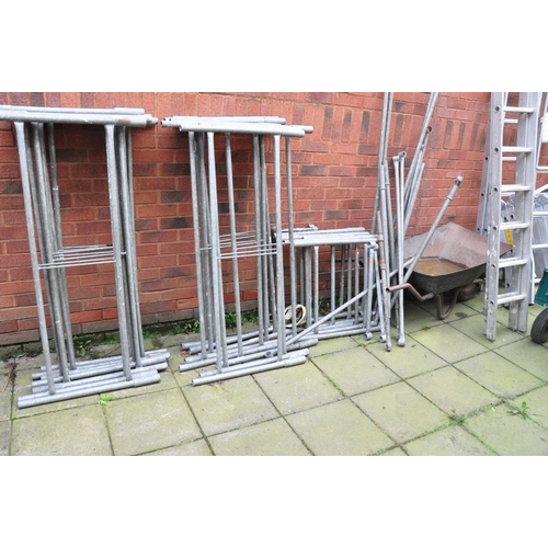 1012 - A GALVANISED STEEL TOWER SCAFFOLD with 16 panels 130cm wide, 5 65cm wide panels, 15 ties and a build... 