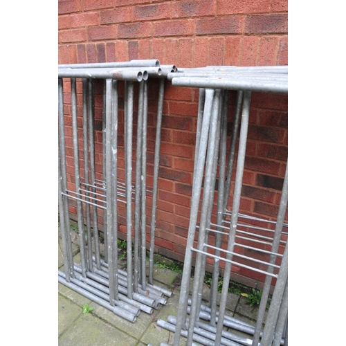 1012 - A GALVANISED STEEL TOWER SCAFFOLD with 16 panels 130cm wide, 5 65cm wide panels, 15 ties and a build... 