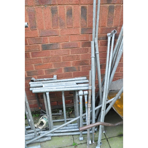 1012 - A GALVANISED STEEL TOWER SCAFFOLD with 16 panels 130cm wide, 5 65cm wide panels, 15 ties and a build... 