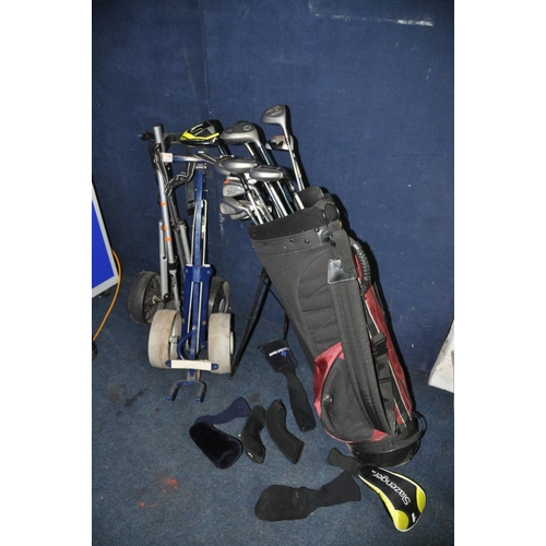 1051 - A SELECTION OF GOLFING EQUIPMENT to include a Progen golf bag containing various clubs, Voodoo, Slaz... 