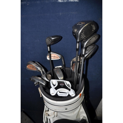 1052 - A PING GOLF BAG CONTAINING TAYLOR MADE CLUBS comprising a partial set of Taylor made clubs along wit... 