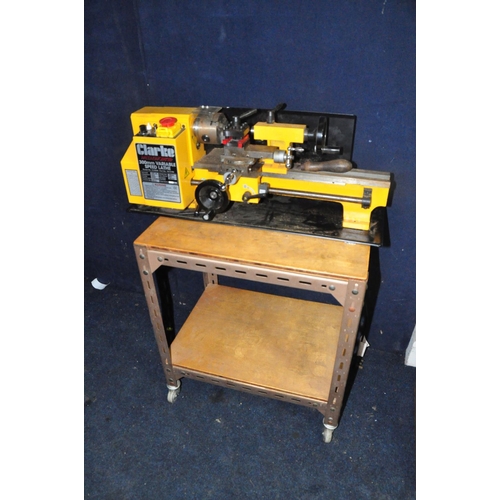 1109 - A CLARKE CL300M 300MM VARIABLE SPEED LATHE attached to metal framed base on casters (UNTESTED due to... 