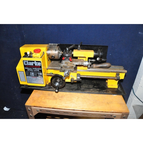 1109 - A CLARKE CL300M 300MM VARIABLE SPEED LATHE attached to metal framed base on casters (UNTESTED due to... 