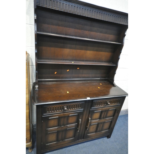 1217 - A 20TH CENTURY OAK DRESSER, plate rack above two drawers and two doors, and a walnut single door dis... 