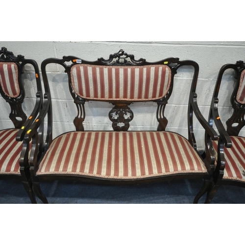 1218 - AN EARLY 20TH CENTURY MAHOGANY PARLOUR SUITE, with carved cresting rails, splat back and open armres... 