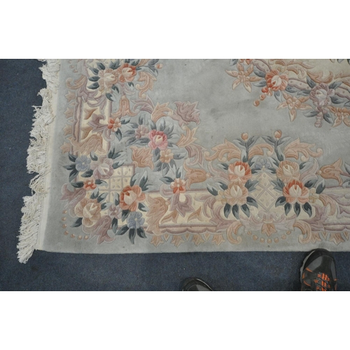 1222 - A TEAL CHINESE WOOLEN RUG, with floral border and central design, 284cm x 186cm (condition - in need... 