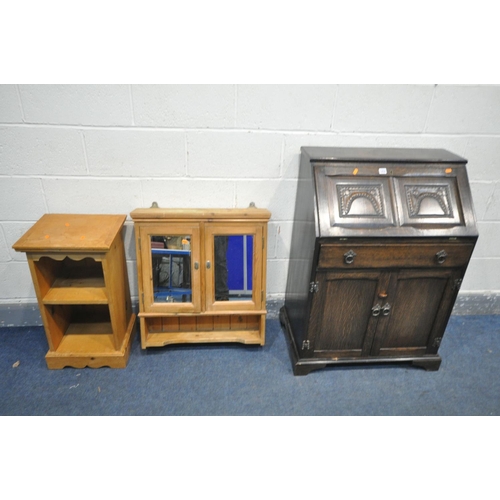 1252 - AN OAK BUREAU, with a single drawers, width 71cm x depth 44cm x height 101cm, a pine hanging cabinet... 