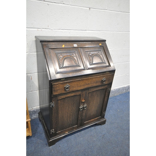 1252 - AN OAK BUREAU, with a single drawers, width 71cm x depth 44cm x height 101cm, a pine hanging cabinet... 