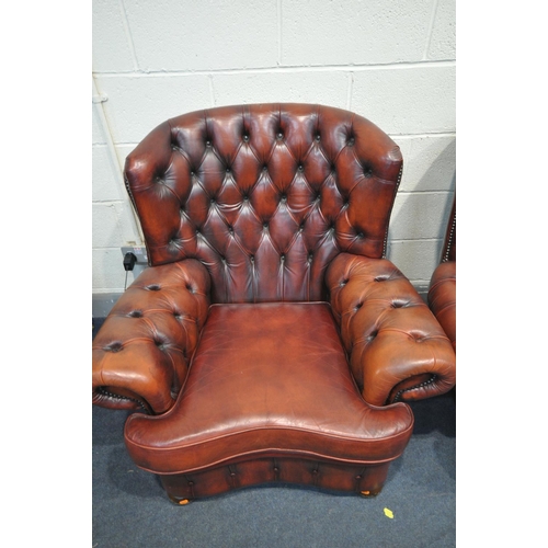 1259 - AN OXBLOOD THREE PIECE CHESTERFIELD SUITE, comprising a three seater sofa, length 202cm, and a pair ... 