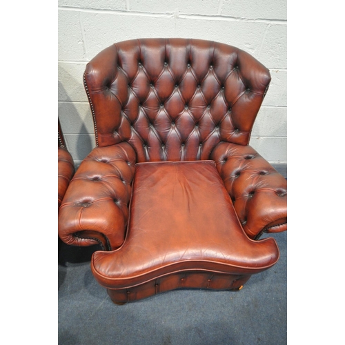 1259 - AN OXBLOOD THREE PIECE CHESTERFIELD SUITE, comprising a three seater sofa, length 202cm, and a pair ... 