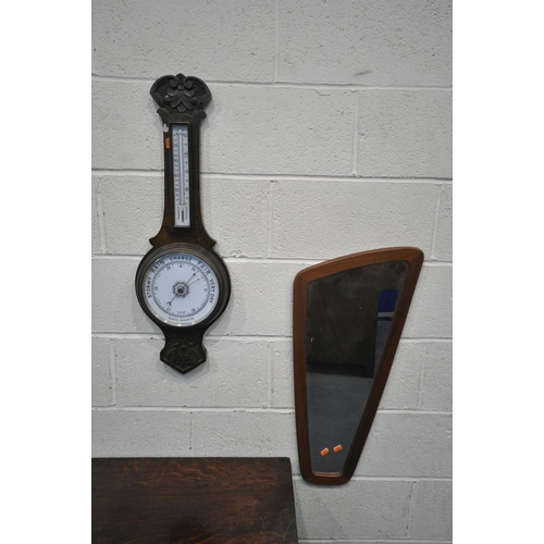 1261 - AN OAK DROP LEAF TEA TROLLEY, an oak aneroid barometer, and a mid-century wall mirror (3)