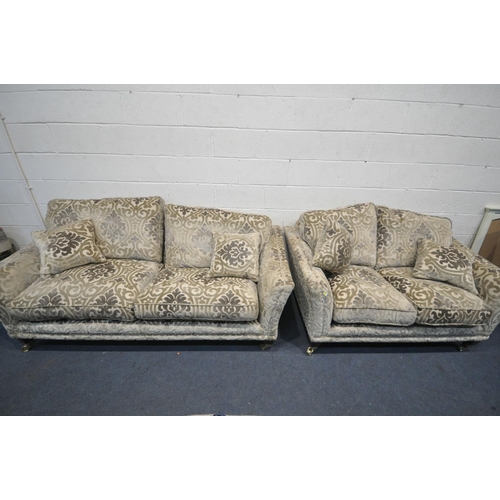 1264 - A PARKER KNOLL FOLIATE DESIGN ON A GOLD GROUND LOUNGE, comprising of two sized two seater settee's, ... 