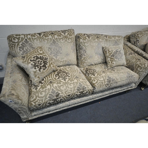 1264 - A PARKER KNOLL FOLIATE DESIGN ON A GOLD GROUND LOUNGE, comprising of two sized two seater settee's, ... 