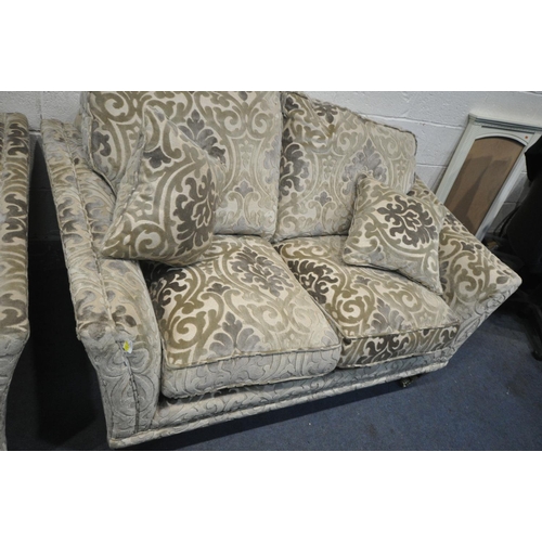 1264 - A PARKER KNOLL FOLIATE DESIGN ON A GOLD GROUND LOUNGE, comprising of two sized two seater settee's, ... 