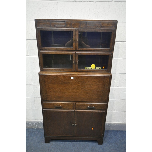 1271 - AN OAK SECTIONAL BOOKCASE/BUREAU, the top two sections with double glazed doors, fall front bureau, ... 