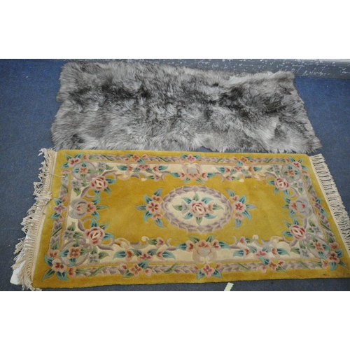 1281 - A CHINESE YELLOW RUG, 160cm x 77cm, and faux fur rug (2)