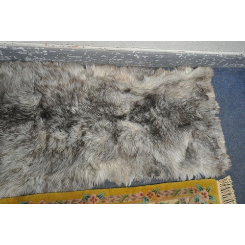 1281 - A CHINESE YELLOW RUG, 160cm x 77cm, and faux fur rug (2)