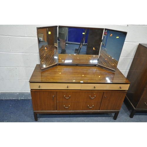 1284 - A MID CENTURY GOLDEN KEY TEAK FINISH BEDROOM SUITE, comprising a dressing table, and a tall chest of... 