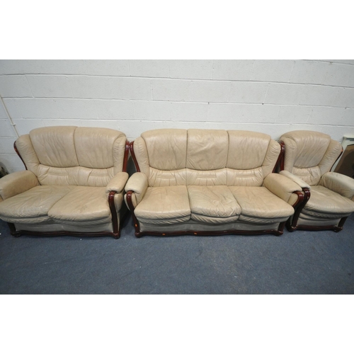 1288 - A CREAM LEATHER THREE PIECE LOUNGE SUITE, comprising a three seater sofa, length 182cm, a two seater... 